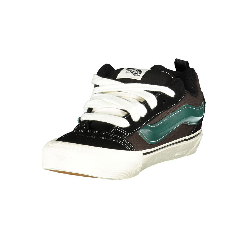 Vans Black Leather Men Sneaker with green stripe and white sole showcasing street style and iconic Vans logo.