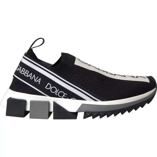 Dolce & Gabbana black and white Sorrento slip-on sock sneakers with logo print and black rubber sole.